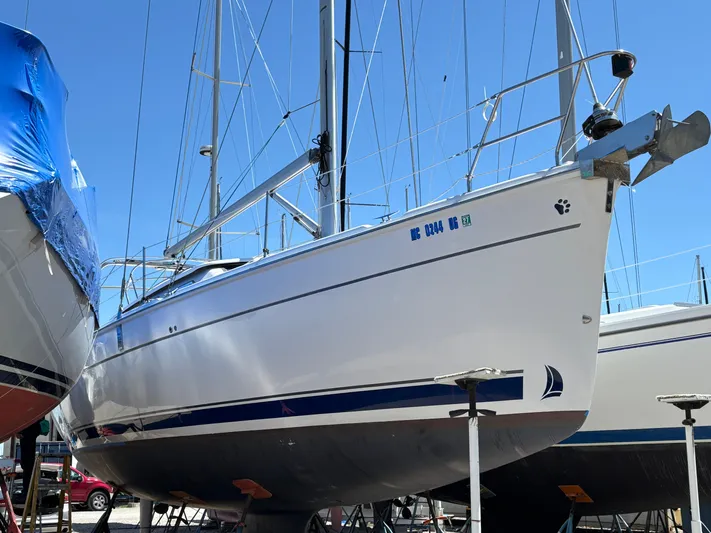 Lucky Dog Too Yacht Photos Pics 2008 Hunter 41 DS sailboat on dry dock under clear blue sky.