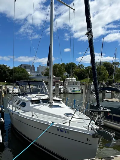 Lucky Dog Too Yacht Photos Pics 2008 Hunter 41 DS sailboat docked at marina under blue sky.