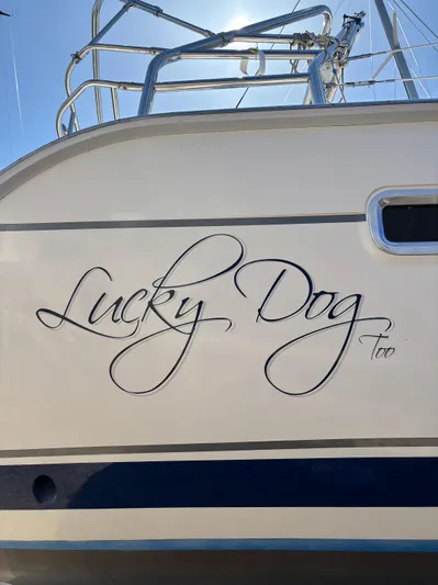Lucky Dog Too Yacht Photos Pics 2008 Hunter 41 DS sailboat with "Lucky Dog Too" name on the hull.