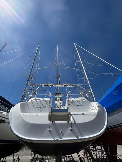 Lucky Dog Too Yacht Photos Pics 2008 Hunter 41 DS sailboat on dry dock under clear blue sky.