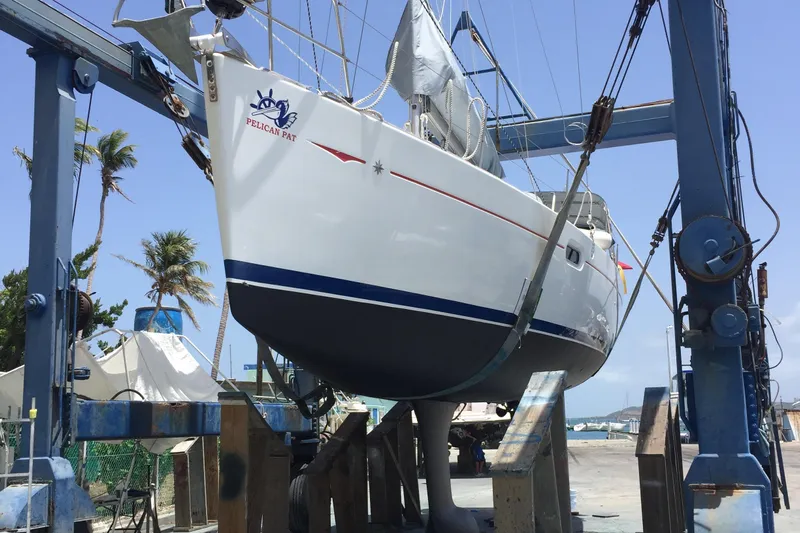Pelican Pat Yacht Photos Pics 2010 Jeanneau Sun Odyssey 42i sailboat in dry dock, undergoing maintenance.