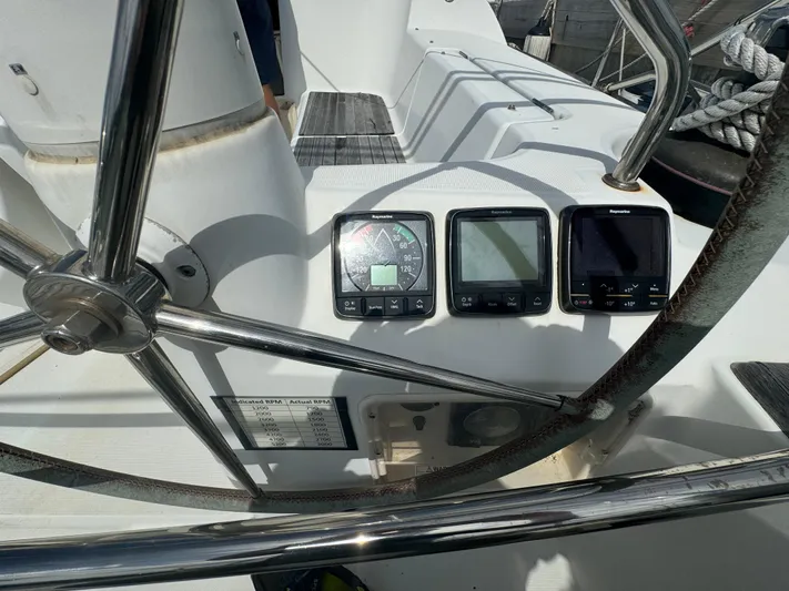 Pelican Pat Yacht Photos Pics Steering wheel and navigation instruments on 2010 Jeanneau Sun Odyssey 42i yacht.