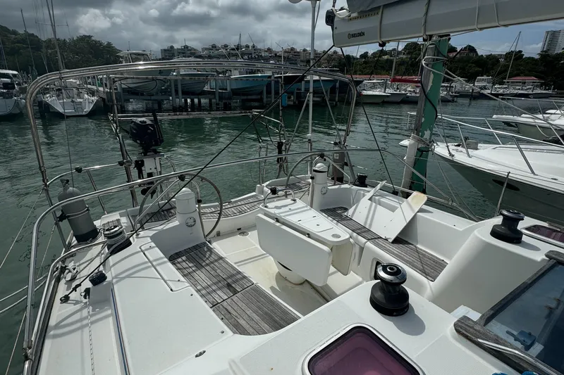 Pelican Pat Yacht Photos Pics 2010 Jeanneau Sun Odyssey 42i sailboat docked at marina, featuring spacious cockpit and modern design.