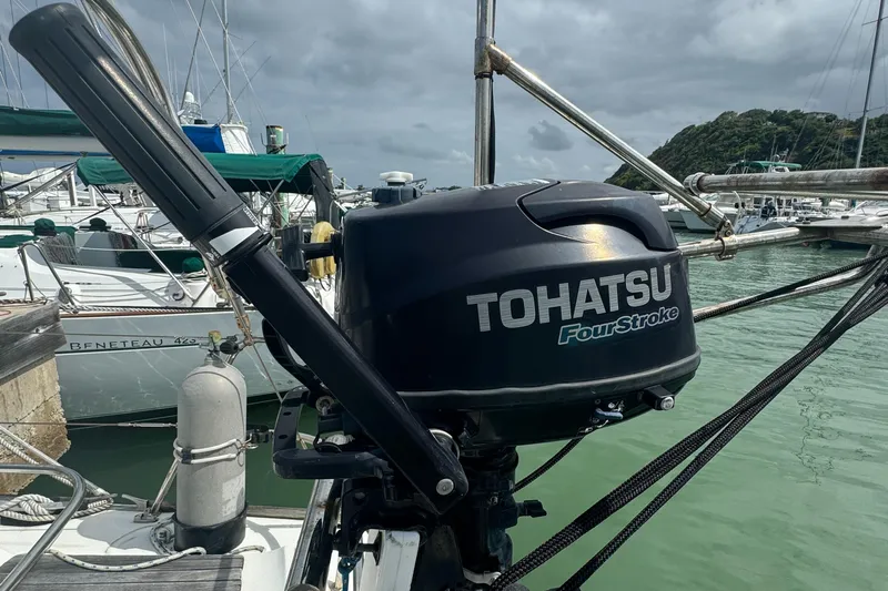 Pelican Pat Yacht Photos Pics Tohatsu FourStroke outboard motor on Jeanneau Sun Odyssey 42i, 2010 model, docked in marina.