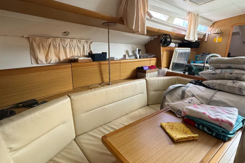Pelican Pat Yacht Photos Pics Interior of 2010 Jeanneau Sun Odyssey 42i sailboat with cozy seating and organized storage.