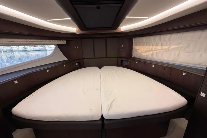  Yacht Photos Pics Luxurious interior cabin of 2024 Galeon 410 HTC yacht with elegant bedding.