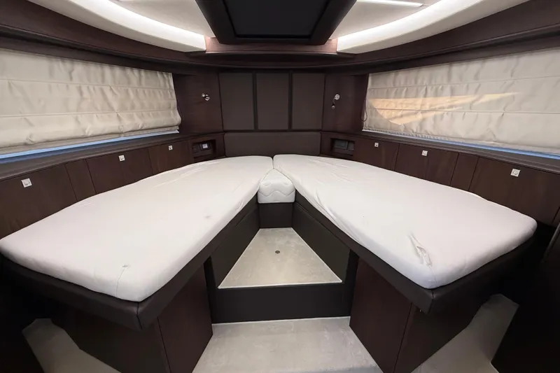  Yacht Photos Pics Luxurious interior cabin of 2024 Galeon 410 HTC yacht with twin beds.
