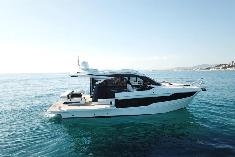  Yacht Photos Pics 2024 Galeon 410 HTC yacht cruising on calm blue waters.