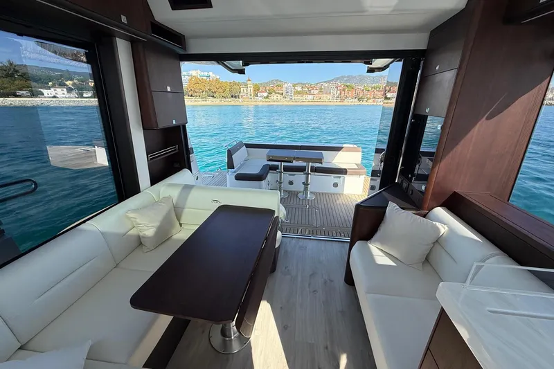  Yacht Photos Pics Luxurious interior of 2024 Galeon 410 HTC yacht with elegant seating and scenic ocean view.