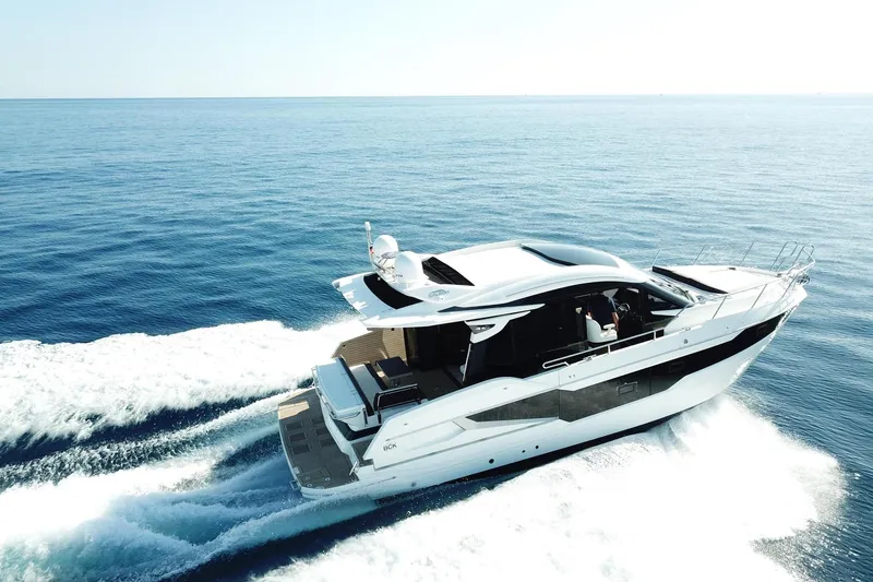  Yacht Photos Pics 2024 Galeon 410 HTC yacht cruising on open sea, showcasing sleek design and luxury.