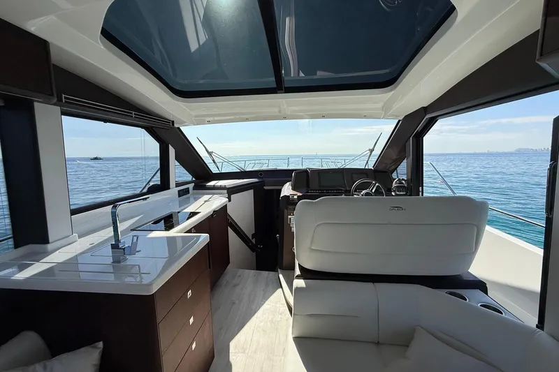  Yacht Photos Pics Luxurious interior of 2024 Galeon 410 HTC yacht with ocean view.
