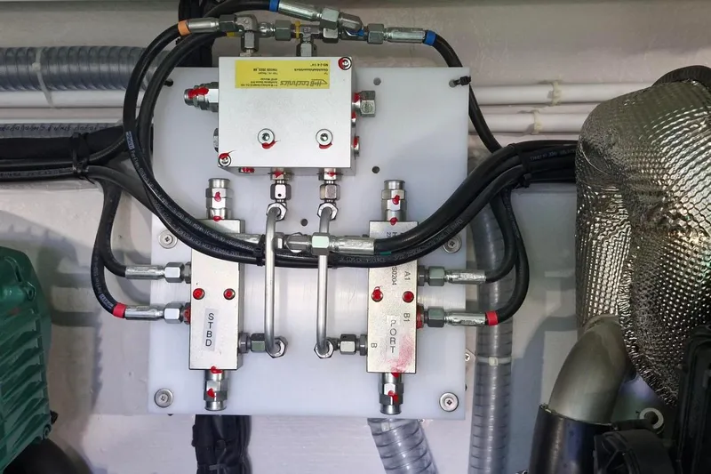  Yacht Photos Pics Engine room of 2024 Galeon 410 HTC yacht showing hydraulic system components.