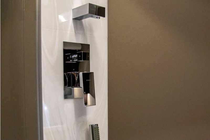  Yacht Photos Pics Modern shower controls in Galeon 410 HTC yacht, 2025 model, featuring sleek chrome fixtures.