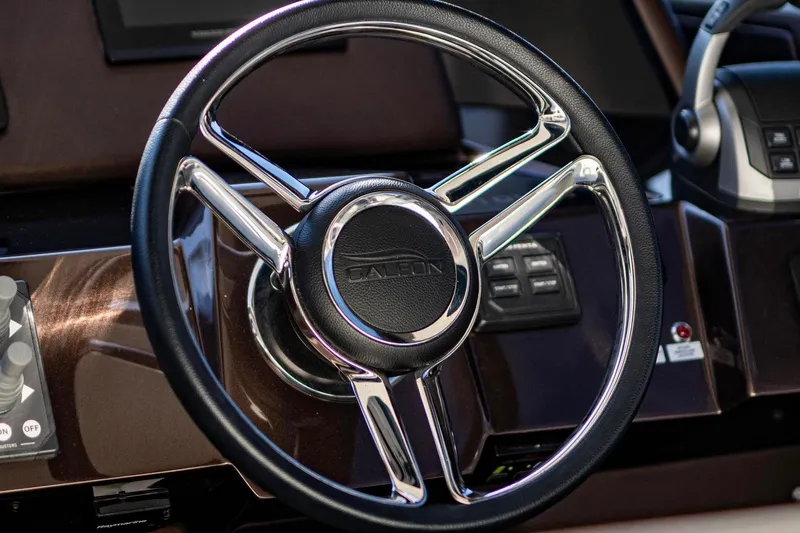  Yacht Photos Pics Steering wheel of 2025 Galeon 410 HTC yacht, featuring sleek chrome and leather design.