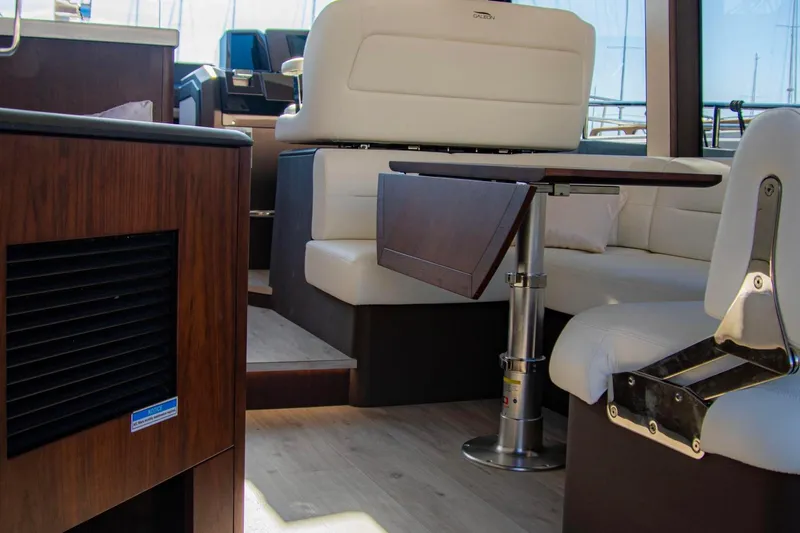  Yacht Photos Pics Interior of 2025 Galeon 410 HTC yacht with modern seating and wooden accents.