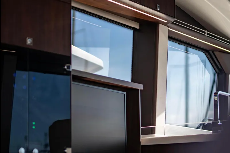  Yacht Photos Pics Interior view of 2025 Galeon 410 HTC yacht, featuring sleek modern design and large windows.