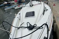 Sailboat Maree Haute DJANGO 770, 2011 model, docked at marina.