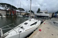 Sailboat Maree Haute DJANGO 770 docked at marina, overcast sky, 2011 model.