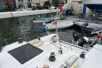 Sailboats docked in a marina, featuring a 2011 Maree Haute DJANGO 770.