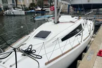 Sailboat Maree Haute DJANGO 770, 2011 model, docked in a marina.