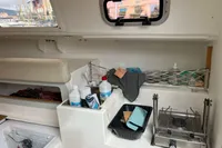 Interior of 2011 Maree Haute DJANGO 770 sailboat with kitchenette and storage.