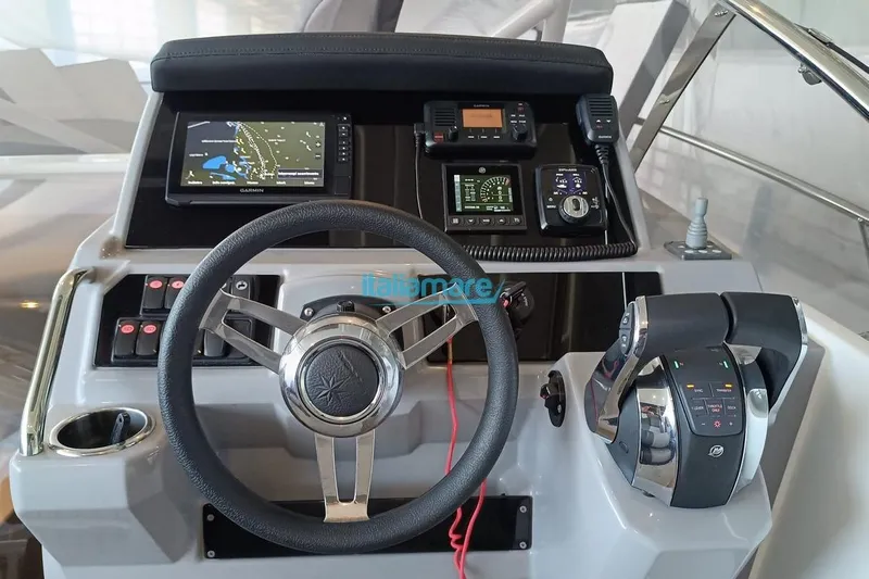 Gigage Yacht Photos Pics Cockpit of 2020 Jeanneau Cap Camarat 9.0 WA with steering wheel and navigation controls.