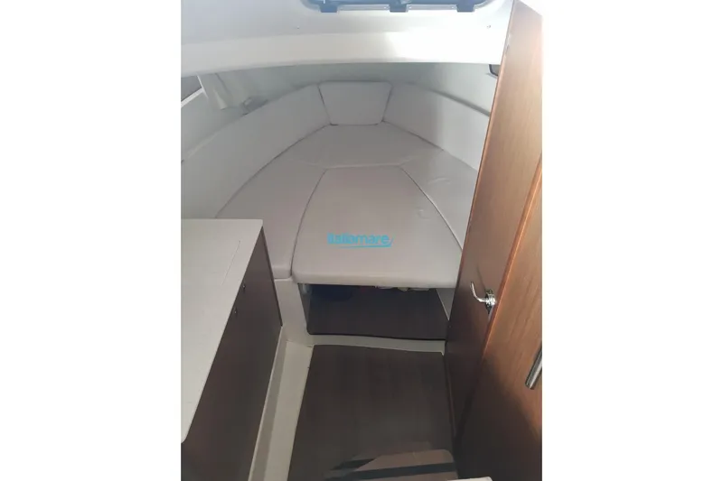 Gigage Yacht Photos Pics Interior cabin of 2020 Jeanneau Cap Camarat 9.0 WA with cushioned seating.