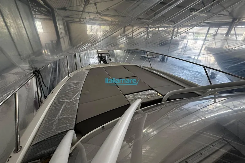 Gigage Yacht Photos Pics 2020 Jeanneau Cap Camarat 9.0 WA boat in storage, covered with protective plastic.