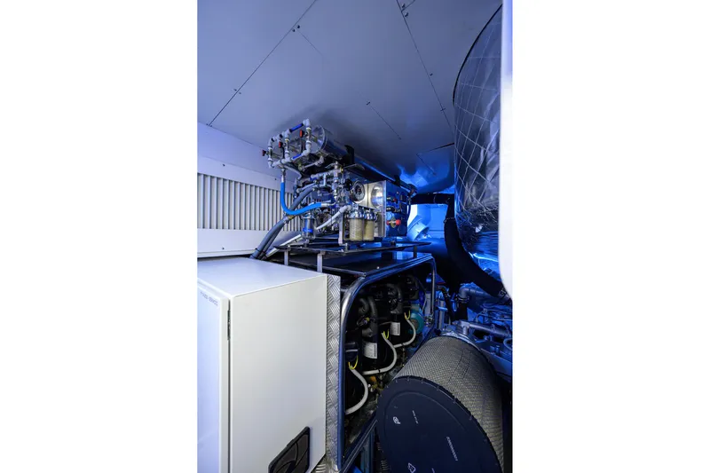 Shine Yacht Photos Pics Engine room of 2022 Pershing 9X yacht, showcasing advanced mechanical systems and components.