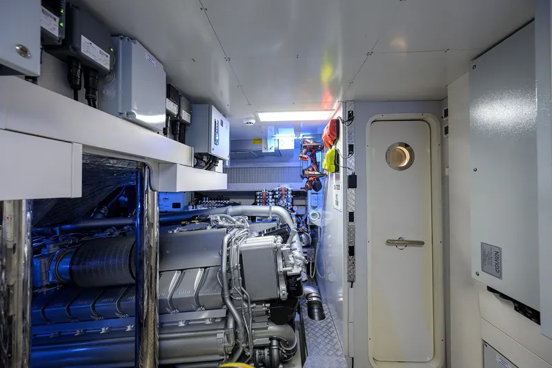 Shine Yacht Photos Pics Engine room of 2022 Pershing 9X yacht, featuring advanced machinery and control systems.