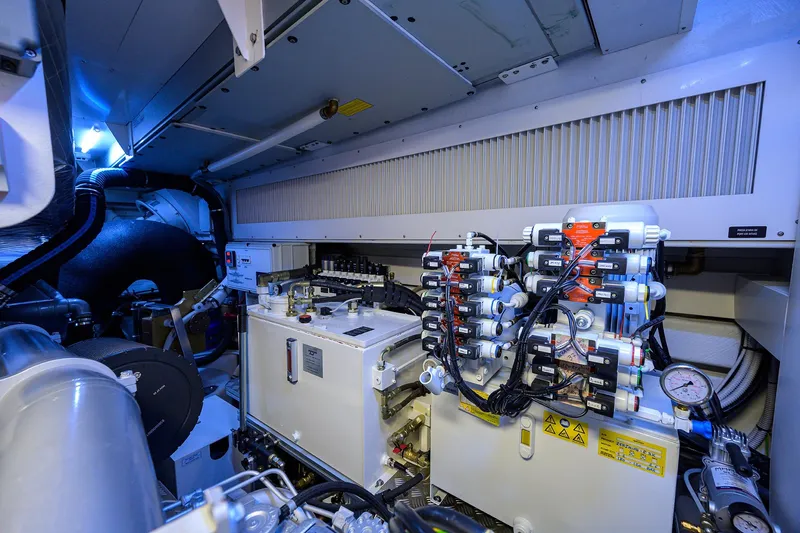 Shine Yacht Photos Pics Engine room of 2022 Pershing 9X yacht with advanced machinery and control systems.