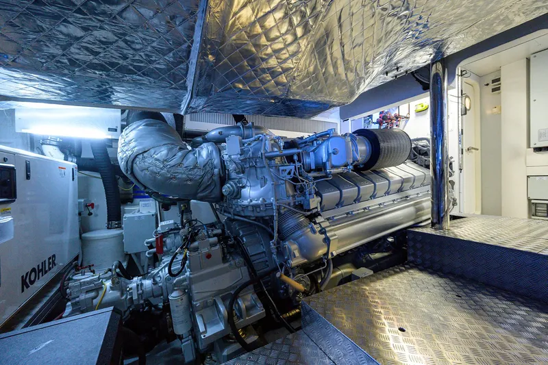 Shine Yacht Photos Pics Engine room of 2022 Pershing 9X yacht with advanced machinery and insulation.