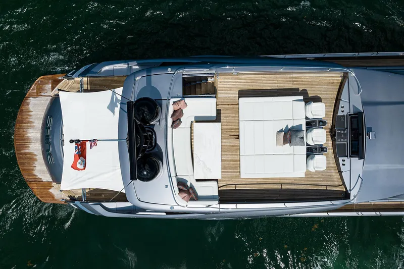 Shine Yacht Photos Pics Aerial view of 2022 Pershing 9X yacht with spacious deck and seating area.