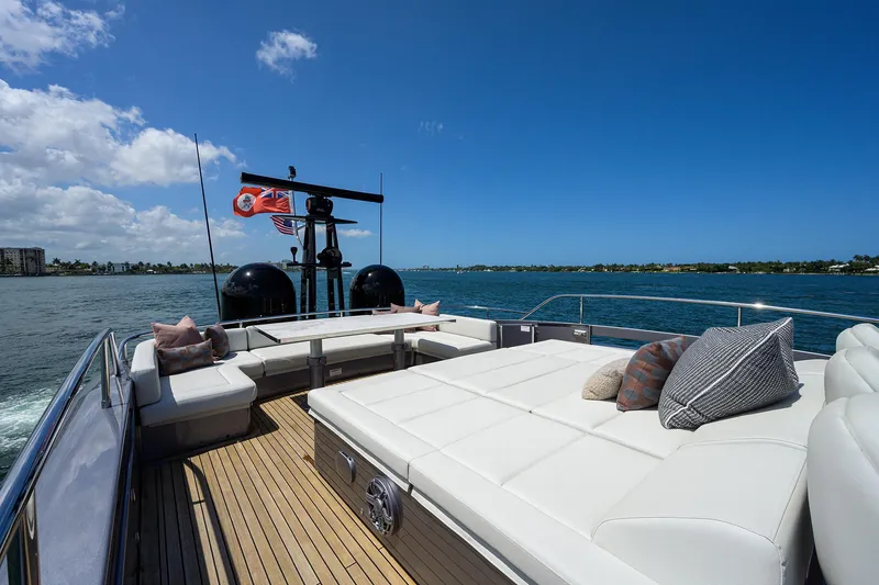 Shine Yacht Photos Pics Luxurious 2022 Pershing 9X yacht deck with plush seating and ocean view.