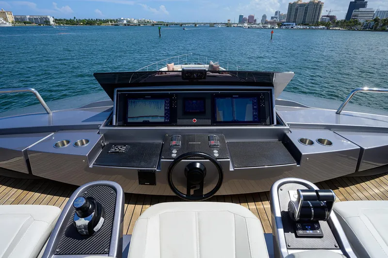 Shine Yacht Photos Pics Cockpit of 2022 Pershing 9X yacht with advanced navigation systems and ocean view.