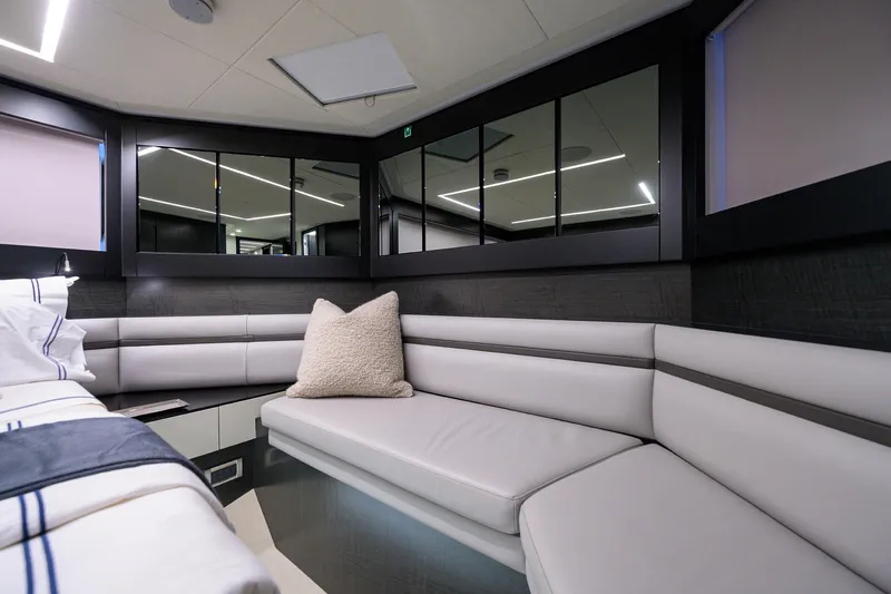 Shine Yacht Photos Pics Luxurious interior of 2022 Pershing 9X yacht with modern seating and elegant decor.