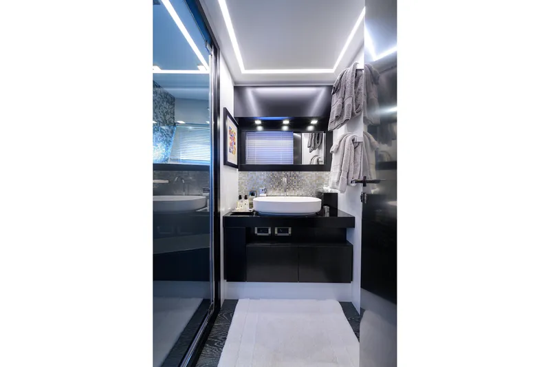 Shine Yacht Photos Pics Luxurious bathroom interior of 2022 Pershing 9X yacht with modern fixtures and elegant design.