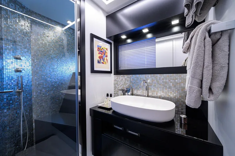 Shine Yacht Photos Pics Luxurious bathroom on 2022 Pershing 9X yacht with modern design and elegant fixtures.