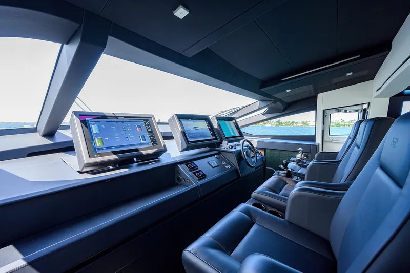 Shine Yacht Photos Pics Luxurious 2022 Pershing 9X yacht cockpit with advanced navigation systems and plush seating.