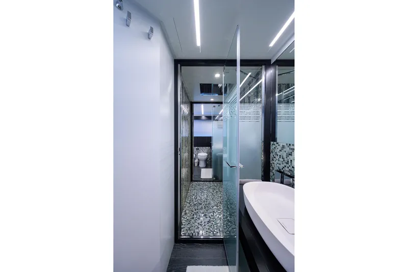 Shine Yacht Photos Pics Luxurious bathroom on 2022 Pershing 9X yacht with modern design and glass accents.