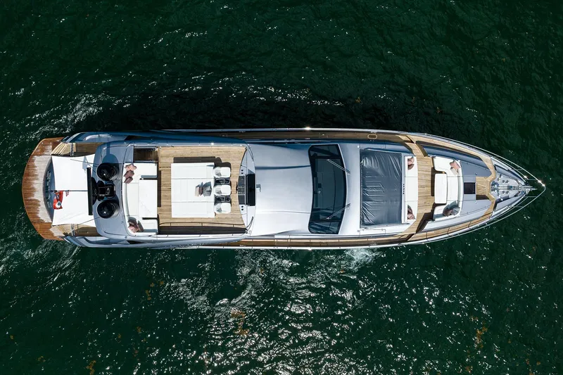 Shine Yacht Photos Pics Aerial view of 2022 Pershing 9X luxury yacht cruising on the ocean.