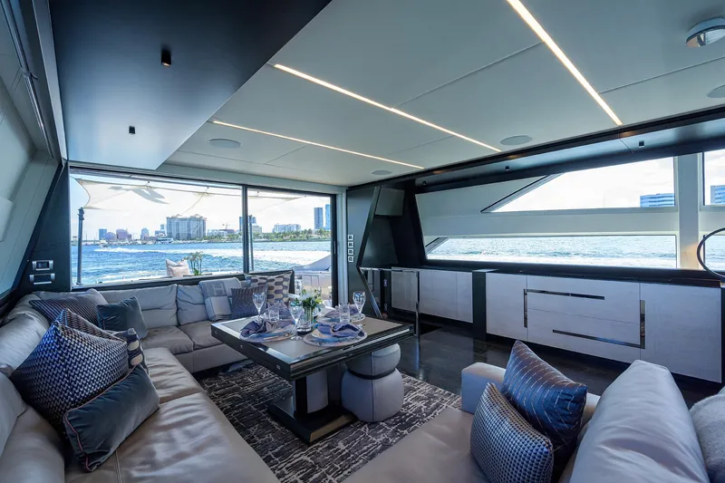 Shine Yacht Photos Pics Luxurious interior of 2022 Pershing 9X yacht with elegant seating and ocean view.