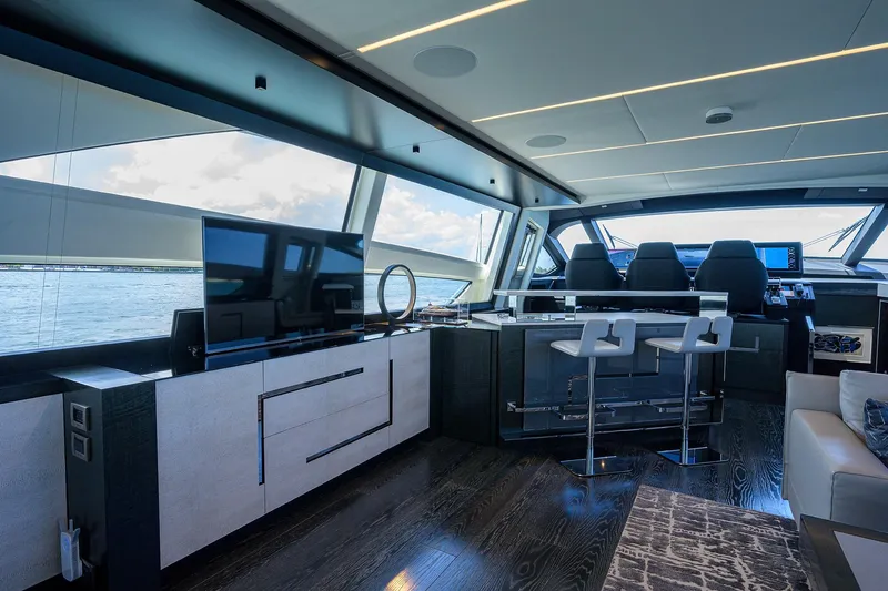 Shine Yacht Photos Pics Luxurious interior of 2022 Pershing 9X yacht with modern seating and panoramic windows.