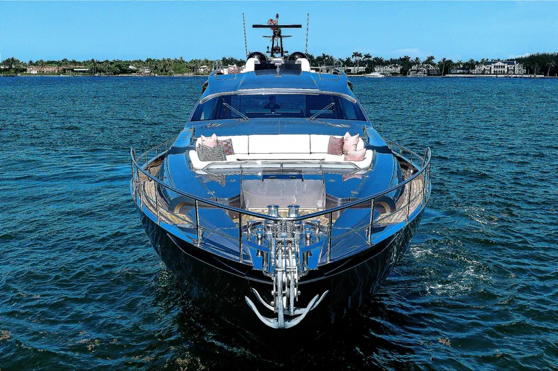 Shine Yacht Photos Pics Luxury 2022 Pershing 9X yacht cruising on open water, front view.