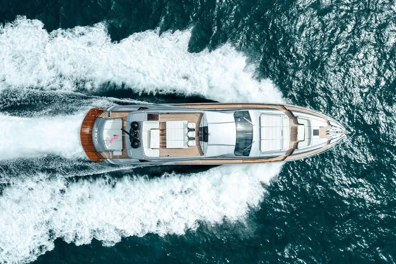 Shine Yacht Photos Pics Top view of 2022 Pershing 9X yacht cruising on the ocean.