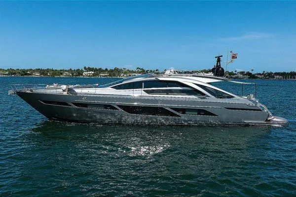 Shine Yacht Photos Pics 2022 Pershing 9X luxury yacht cruising on open water under clear blue skies.