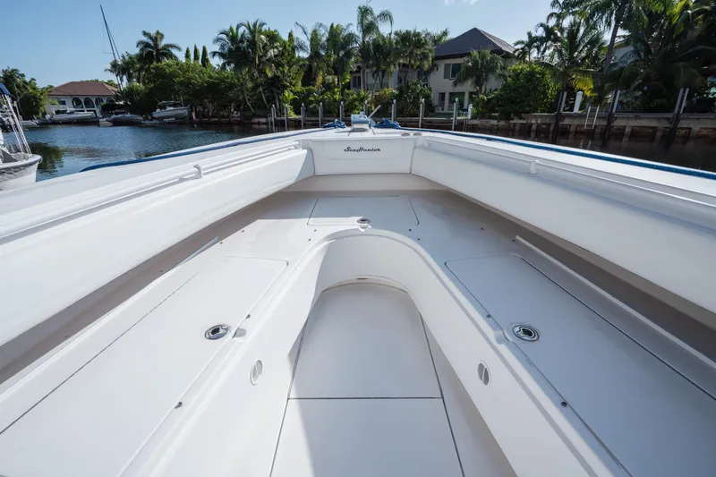  Yacht Photos Pics 2009 SeaHunter 40 boat interior with spacious deck, docked near waterfront homes.
