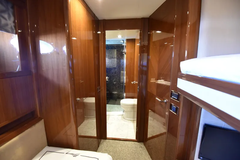 Princess One Yacht Photos Pics Luxurious bathroom interior of 2014 Princess Flybridge 98Y Motor Yacht with wood paneling.