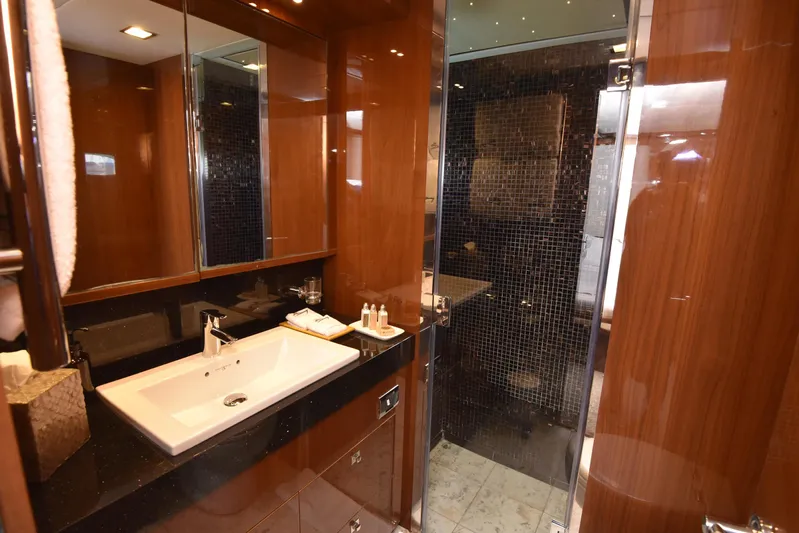 Princess One Yacht Photos Pics Luxurious bathroom in 2014 Princess Flybridge 98Y Motor Yacht with sleek wood finishes.