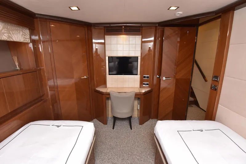 Princess One Yacht Photos Pics Luxurious cabin interior of 2014 Princess Flybridge 98Y Motor Yacht with twin beds and TV.
